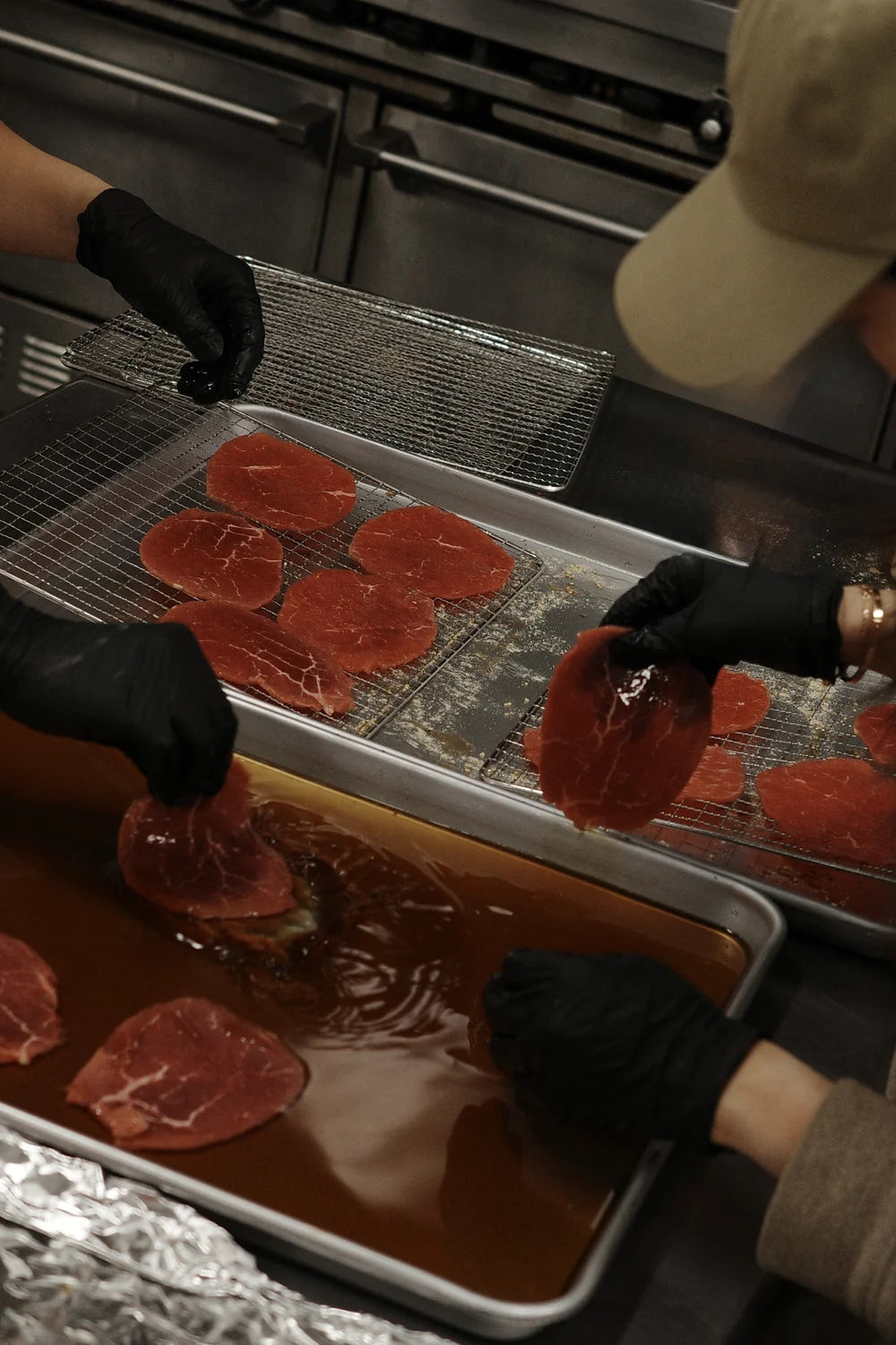 Slices dipped by hand in the marinade tray