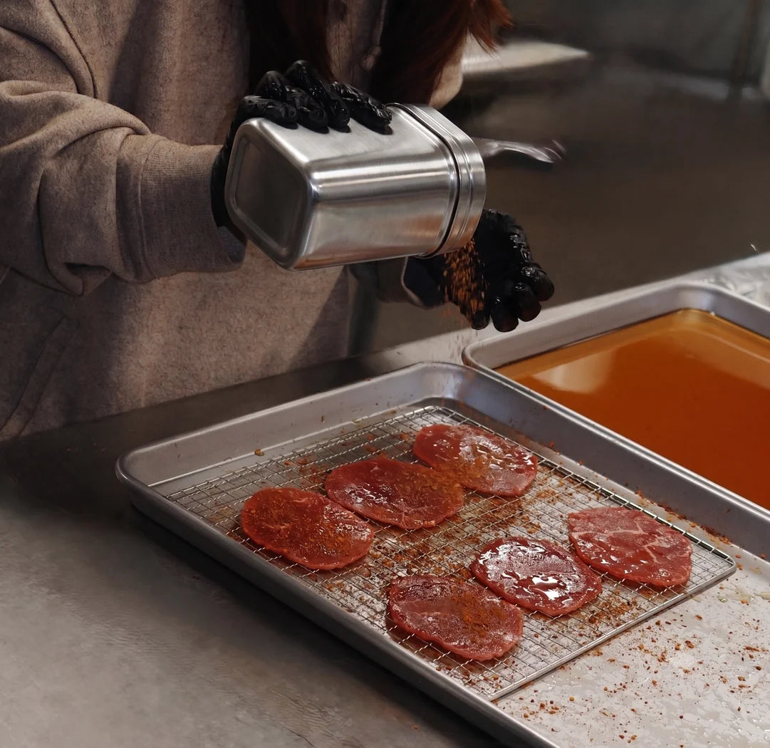 The spice shake over the racked slices